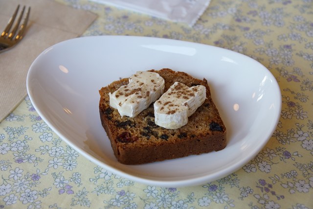 Photo of a square brown cookie about 1 cm thick on a small plate